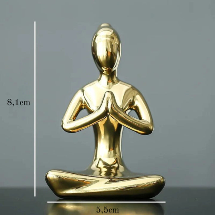 Estatuetas yoga em cerâmica dourada, perfeitas para decoração de escritórios e salas zen.